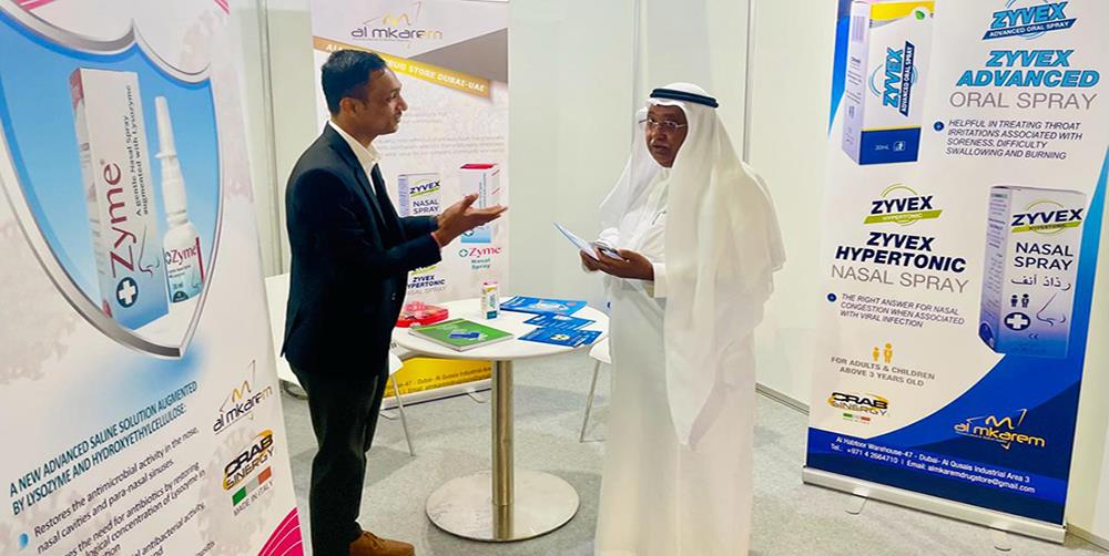 Zyme product booth discussion with healthcare visitor